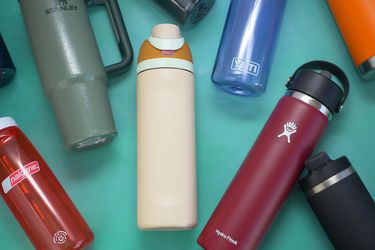 water bottles laying on a green surface