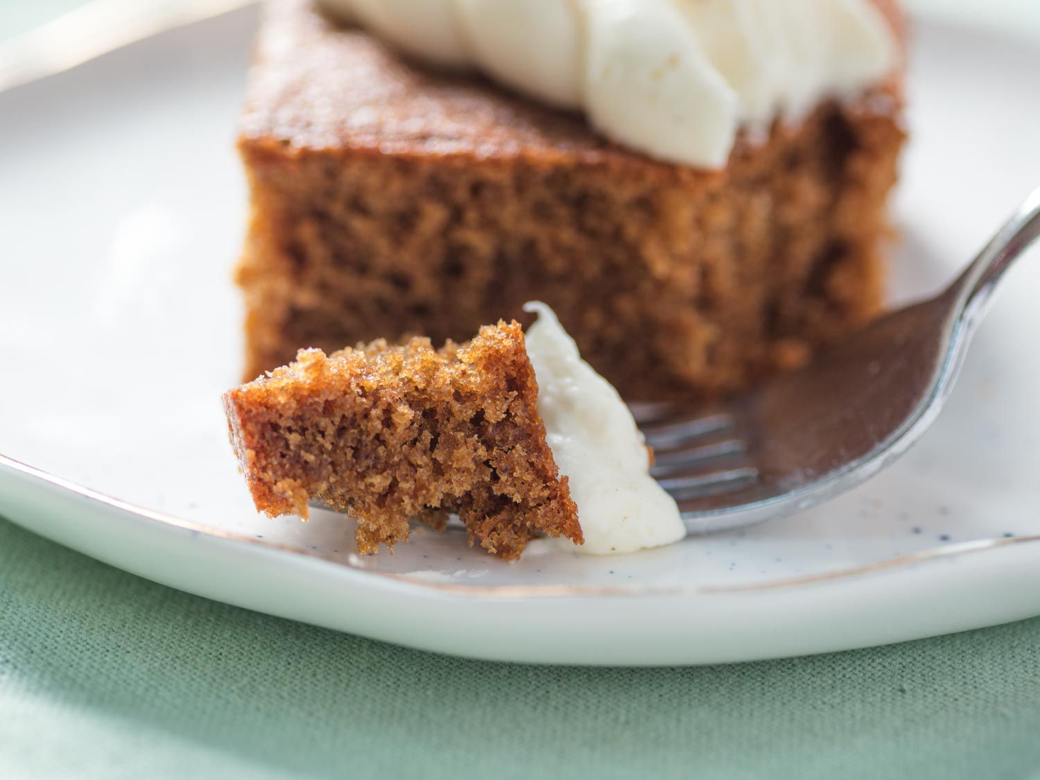  a piece of gingerbread cake cut with a fork. 