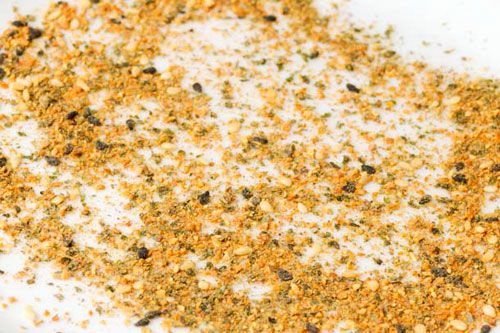 A seven spice powder (shichimi togarashi) spread out on a plate. 