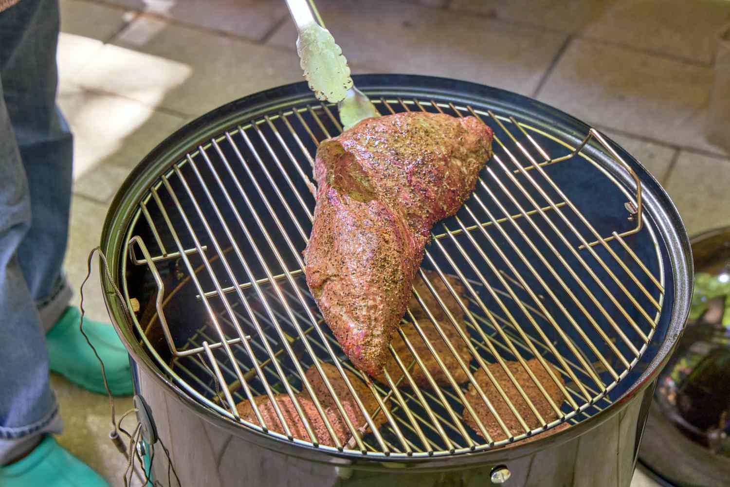 A piece of meat cooked in the Weber 18-Inch Smokey Mountain Cooker