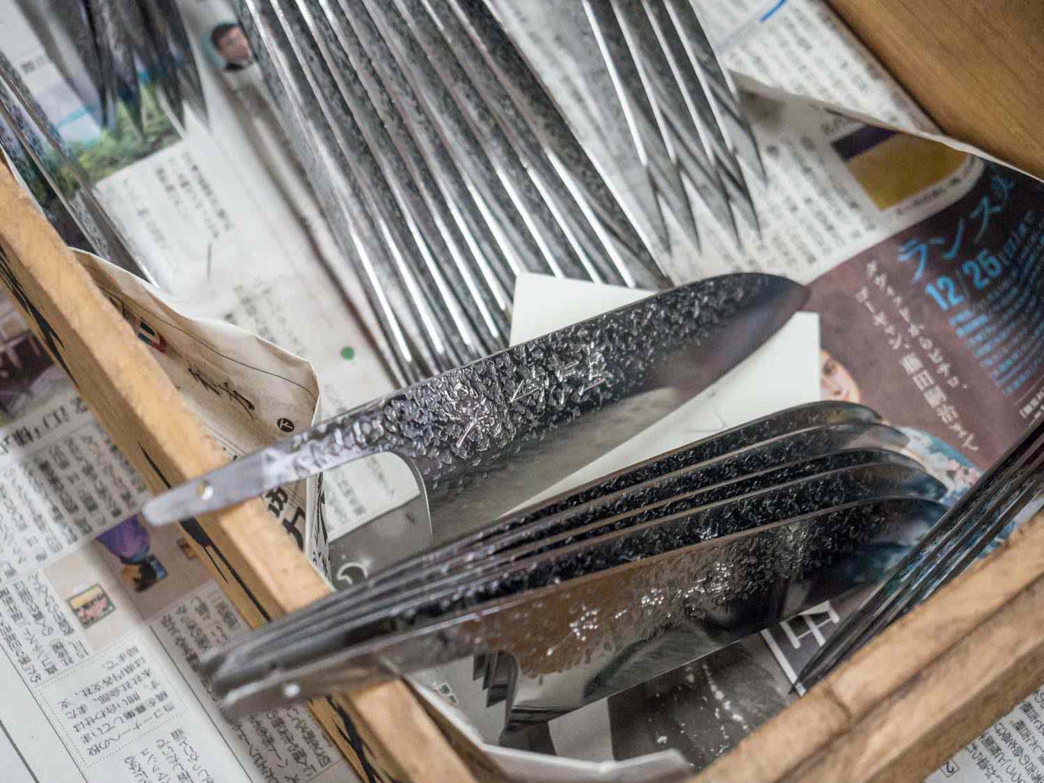 Polished and sharpened santoku knives awaiting handles.
