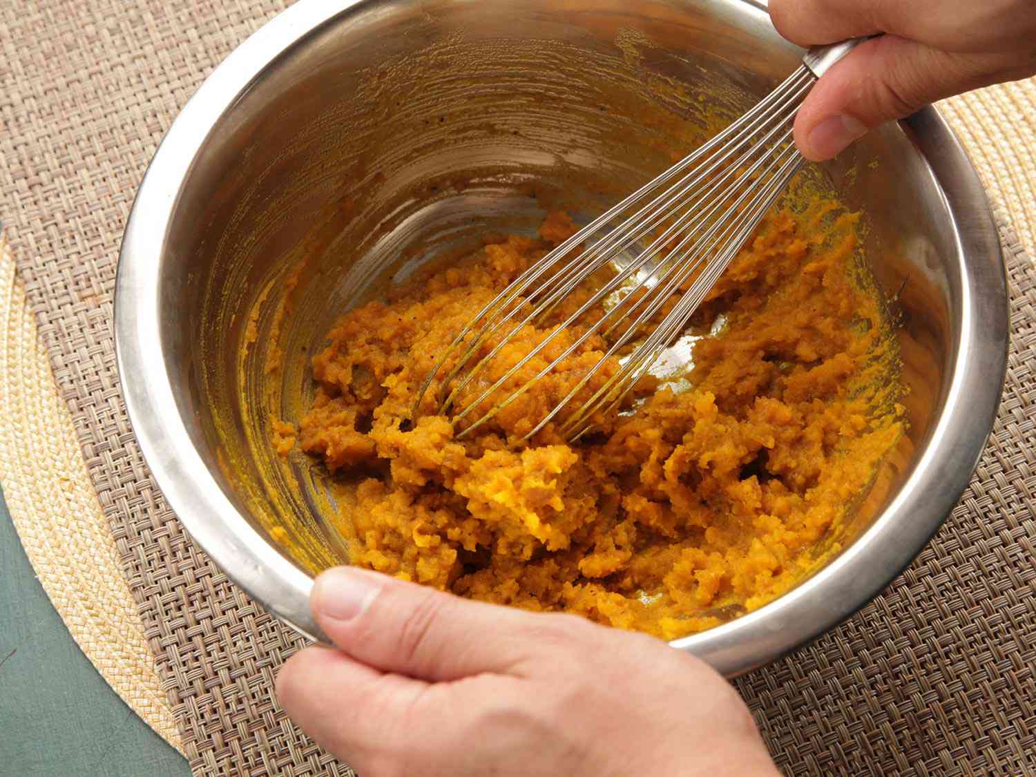 Whisking together the mashed squash.