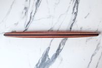 Earlywood French Rolling Pin on a marble surface