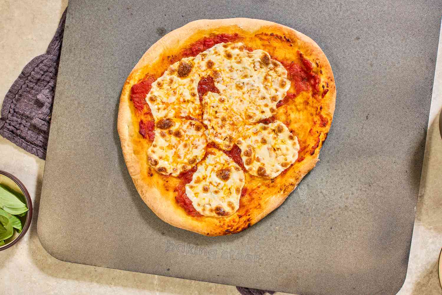  A cooked pizza on a pizza steel.