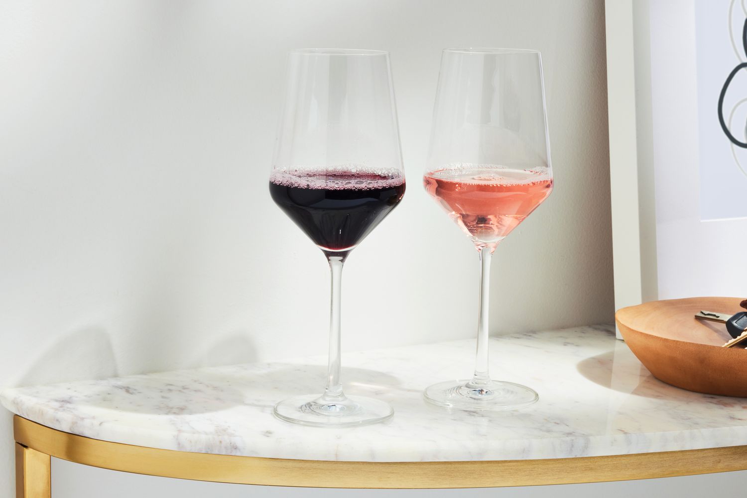 Two Schott Zwiesel Tritan Pure Cabernet Wine Glasses filled with wine on a counter