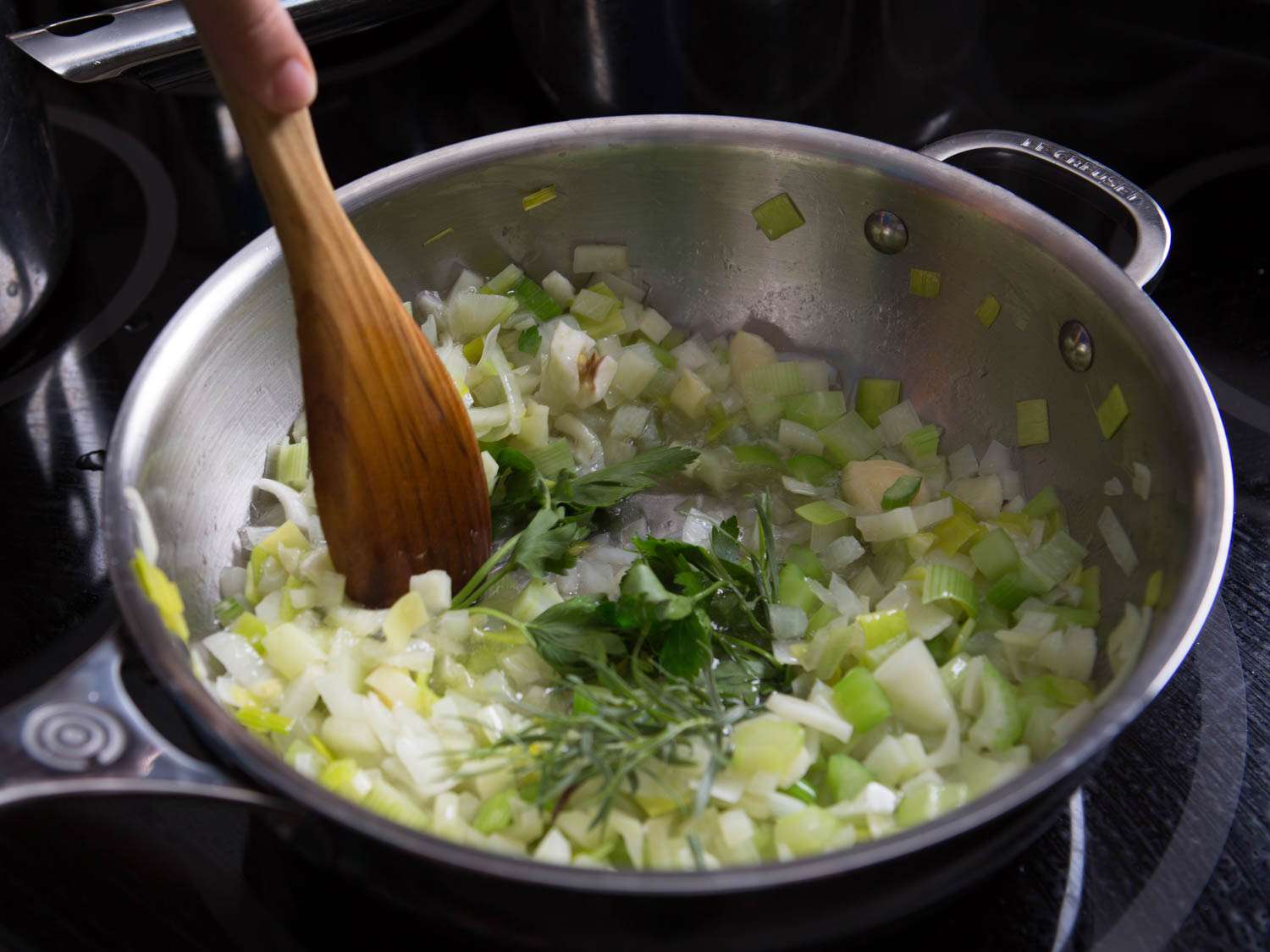 Sweating aromatics for fumet. 