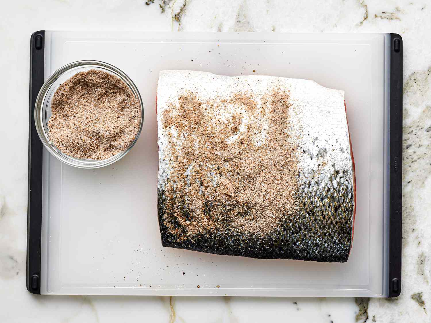 Overhead view of salt on salmon skin