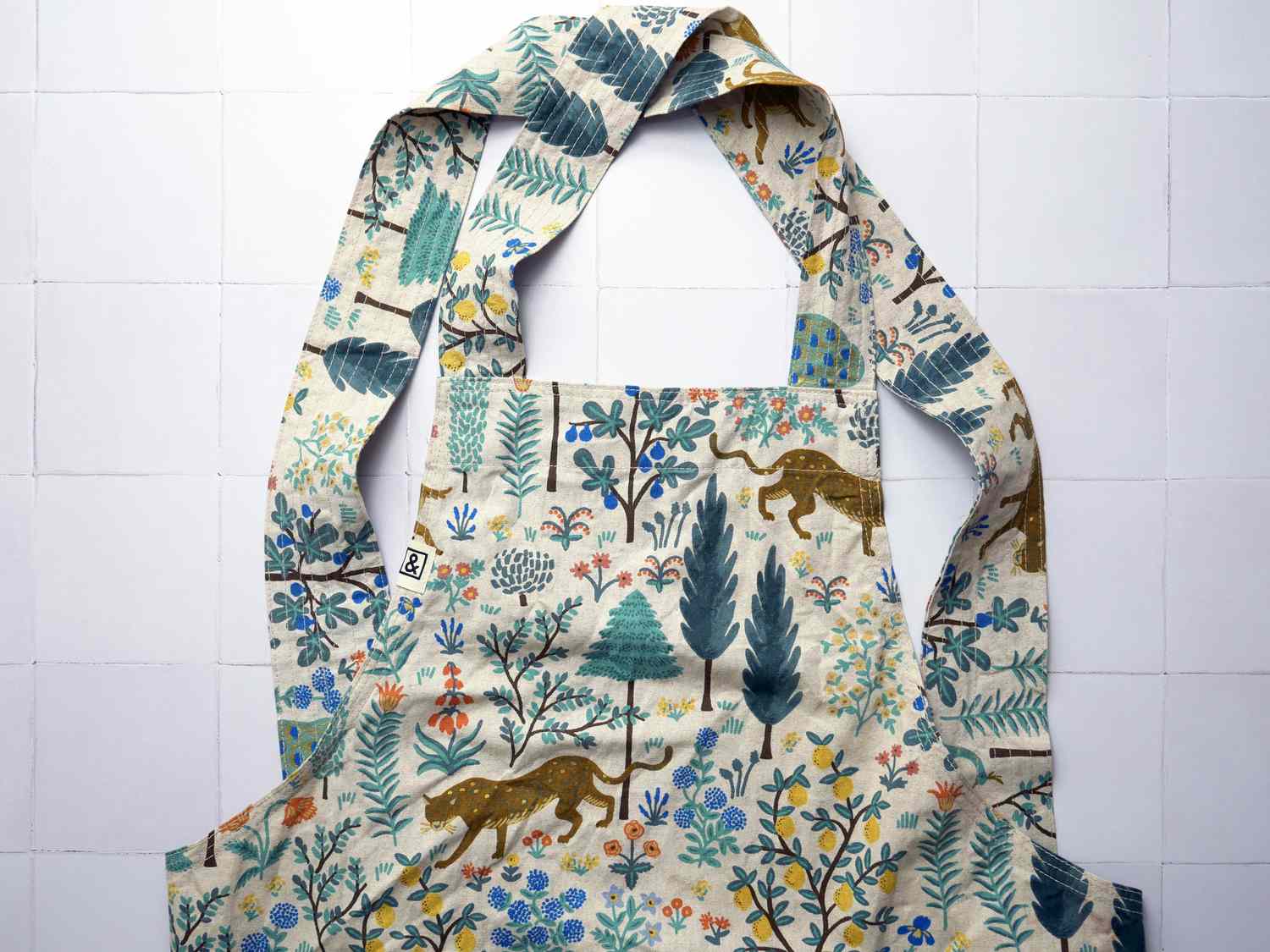 the hedley and bennett smock apron on a white tile surface