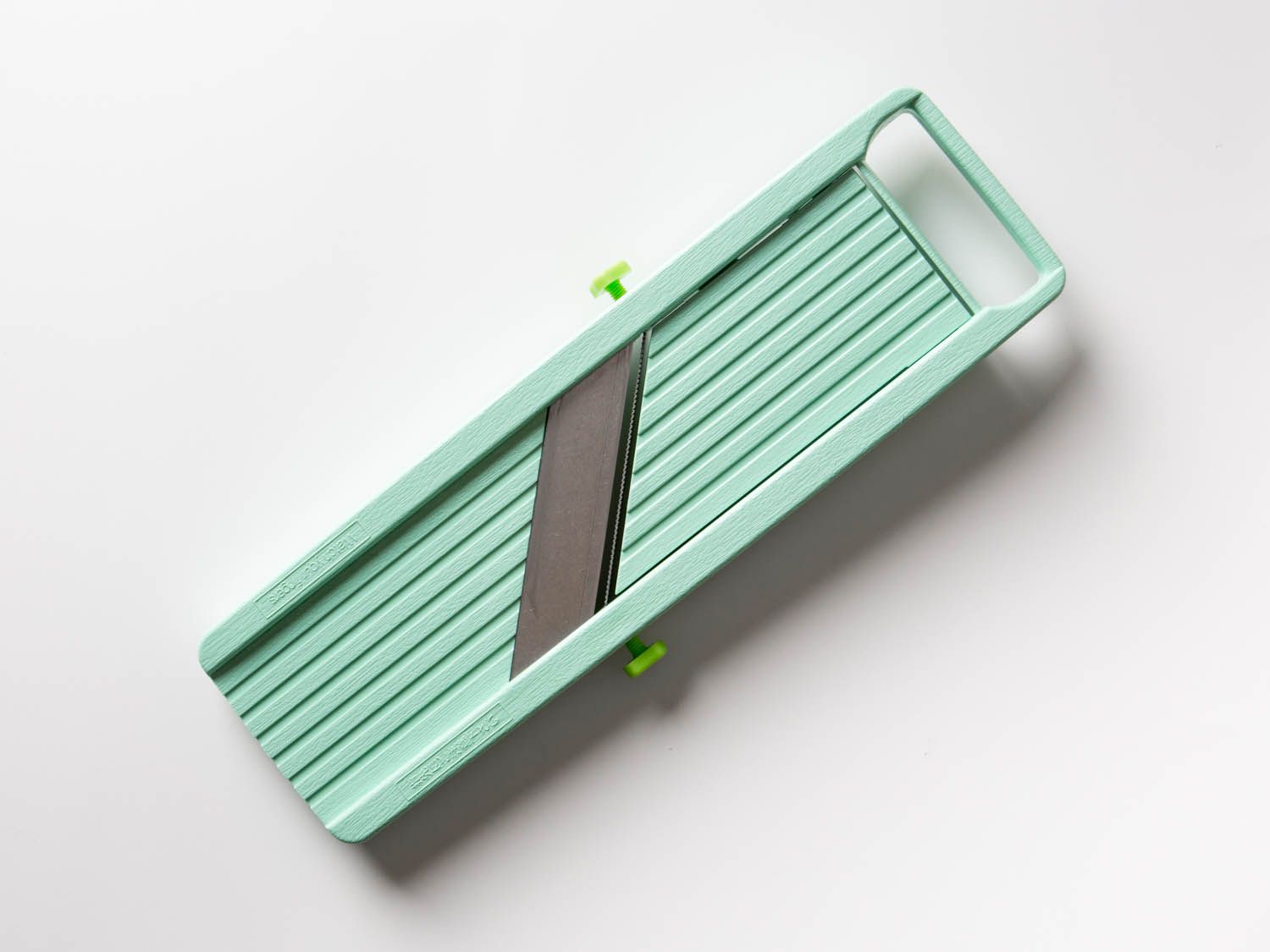 The Benriner mandoline on a white countertop