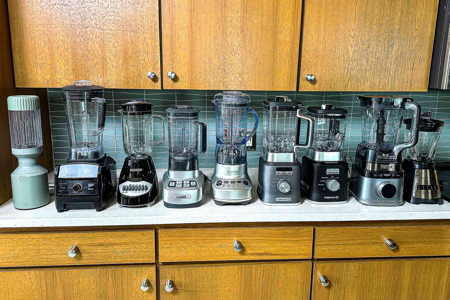 A group of blenders on a kitchen countertop