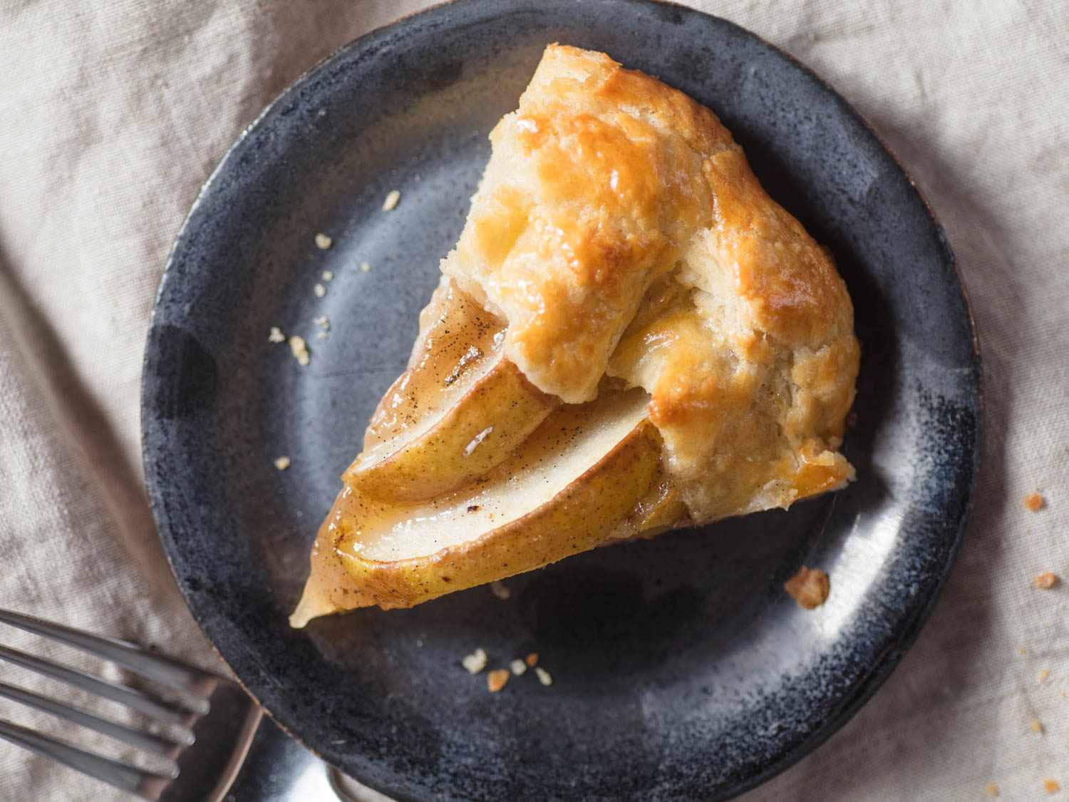 Overhead view of a plated slice of pear galette.