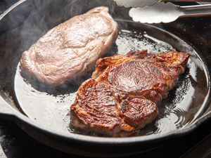 Two steaks in a cast iron pan