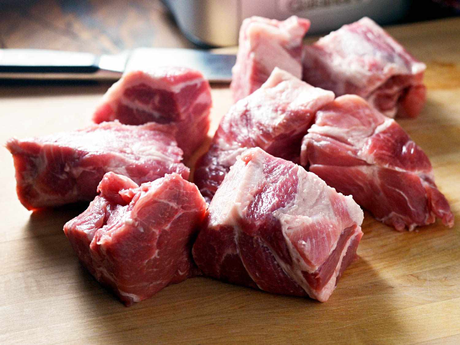Chunks of raw pork shoulder