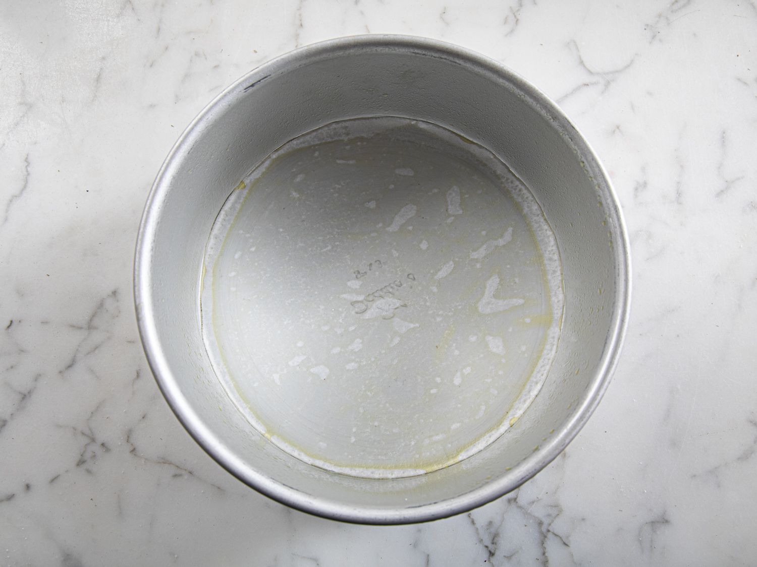 Overhead view of pan lined with parchment paper