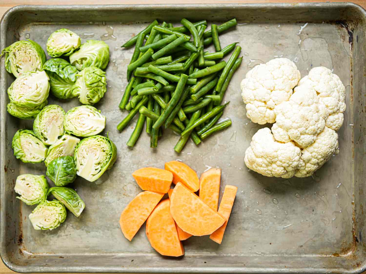 Overhead view of vegetables on a sheet tray