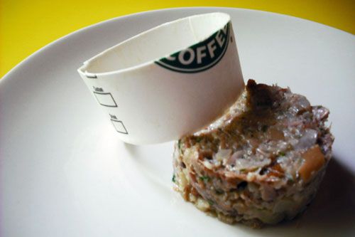 Using a sliced coffee cup to plate molded pig's trotter terrine.