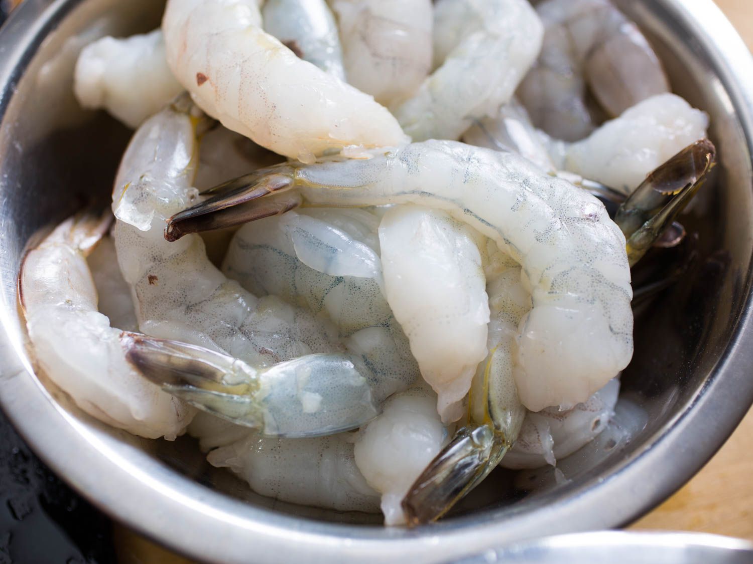 Peeled and deveined raw shrimp in a bowl