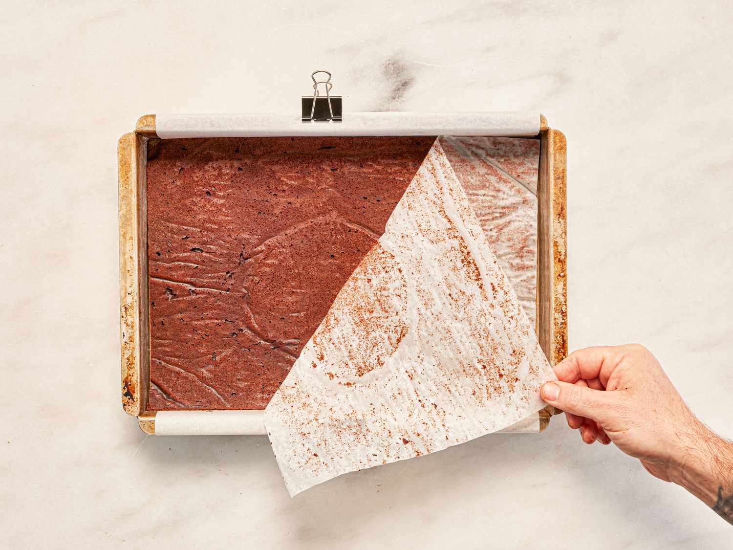 Overhead view of peeling off parchment paper