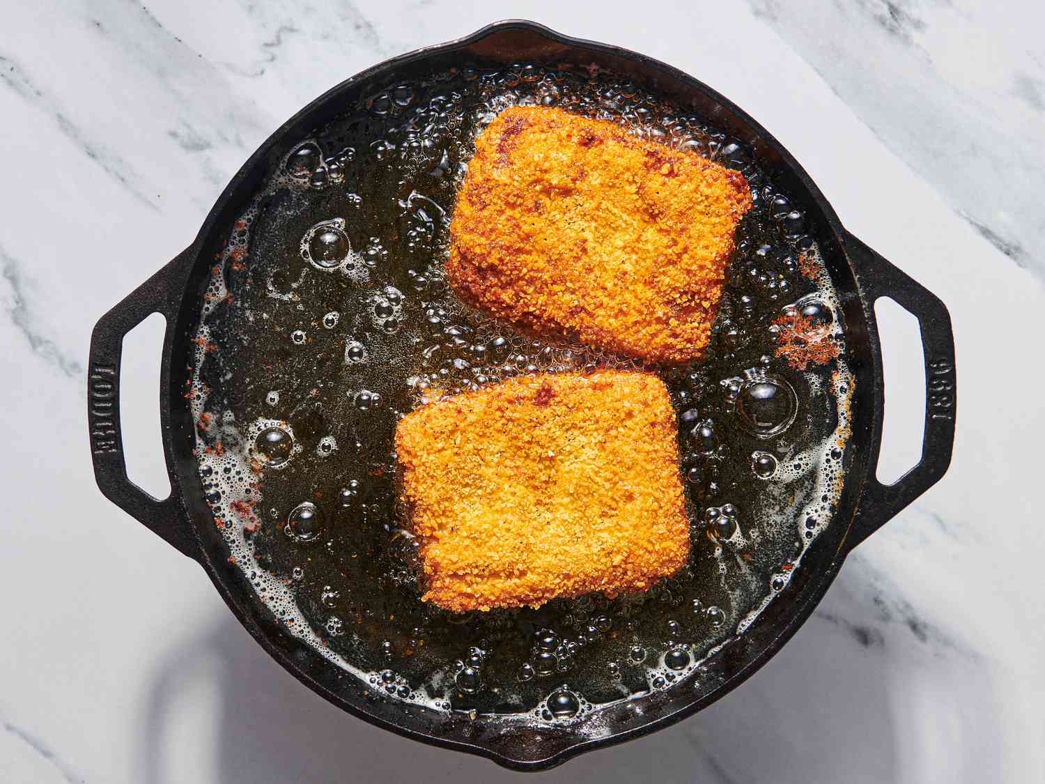 Overhead view of frying mozzarella in carrozza