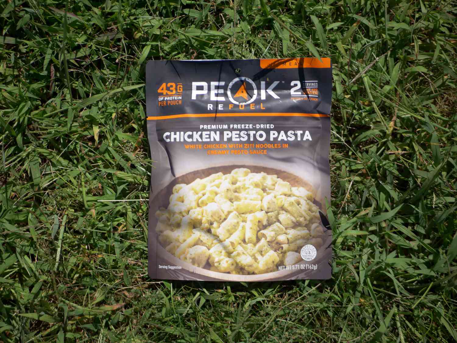 peak refuel chicken pesto pasta on a grassy lawn