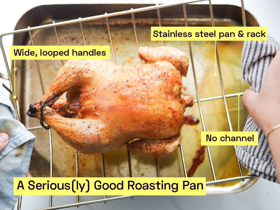 A whole chicken roasting in a roasting pan.
