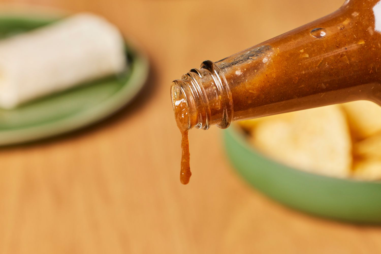The Pepper Plant Original Hot Sauce (2 Pack) being poured