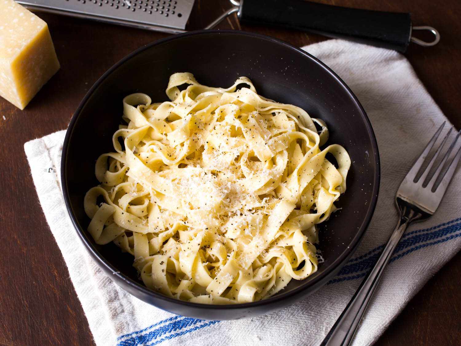 A bowl of fresh homemade pasta with Parmesan.