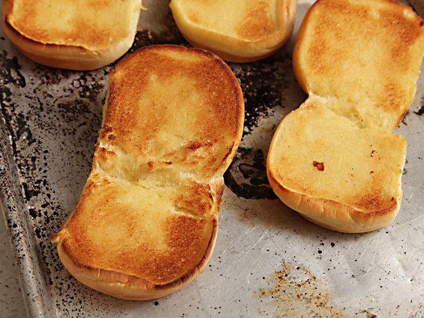 Toasted burger buns, ready to be filled.