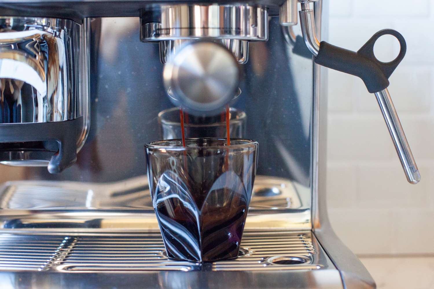 Espresso being brewed into a Not Neutral espresso cup.