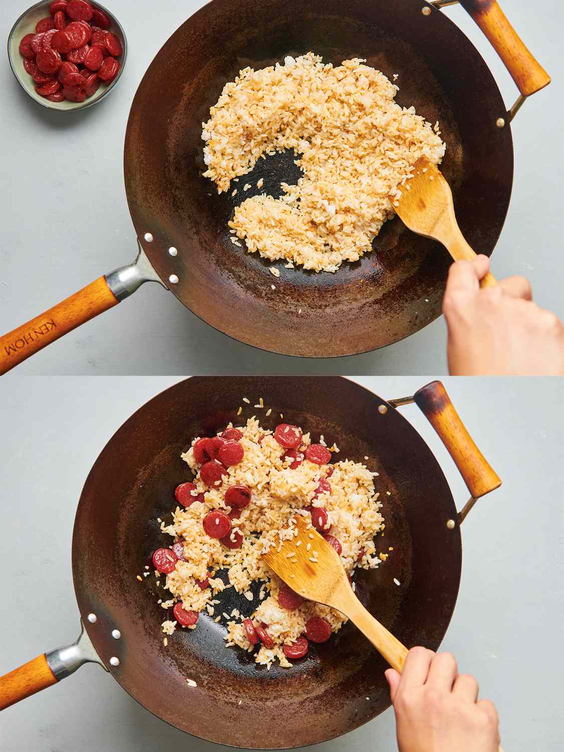 A two-image collage. The top image shows rice added to the browned garlic and rendered fat, being tossed together with a flat bamboo spatula held by a hand. The bottom image shows the browned sausage now added to the wok, and being mixed together by the bamboo spatula.