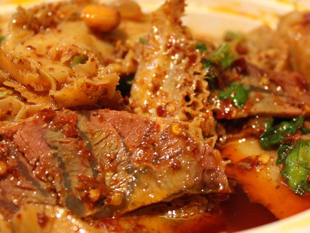 Slices of beef brisket and tripe dressed in chile oil. 