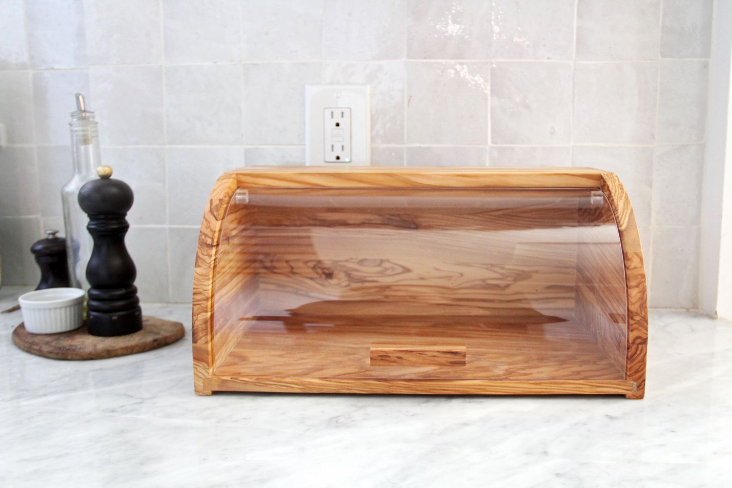 The Williams Sonoma bread box on a marble kitchen coutnertop.
