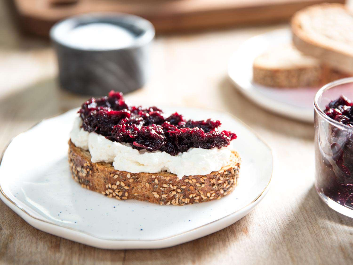 Cherry jam on ricotta and toast.