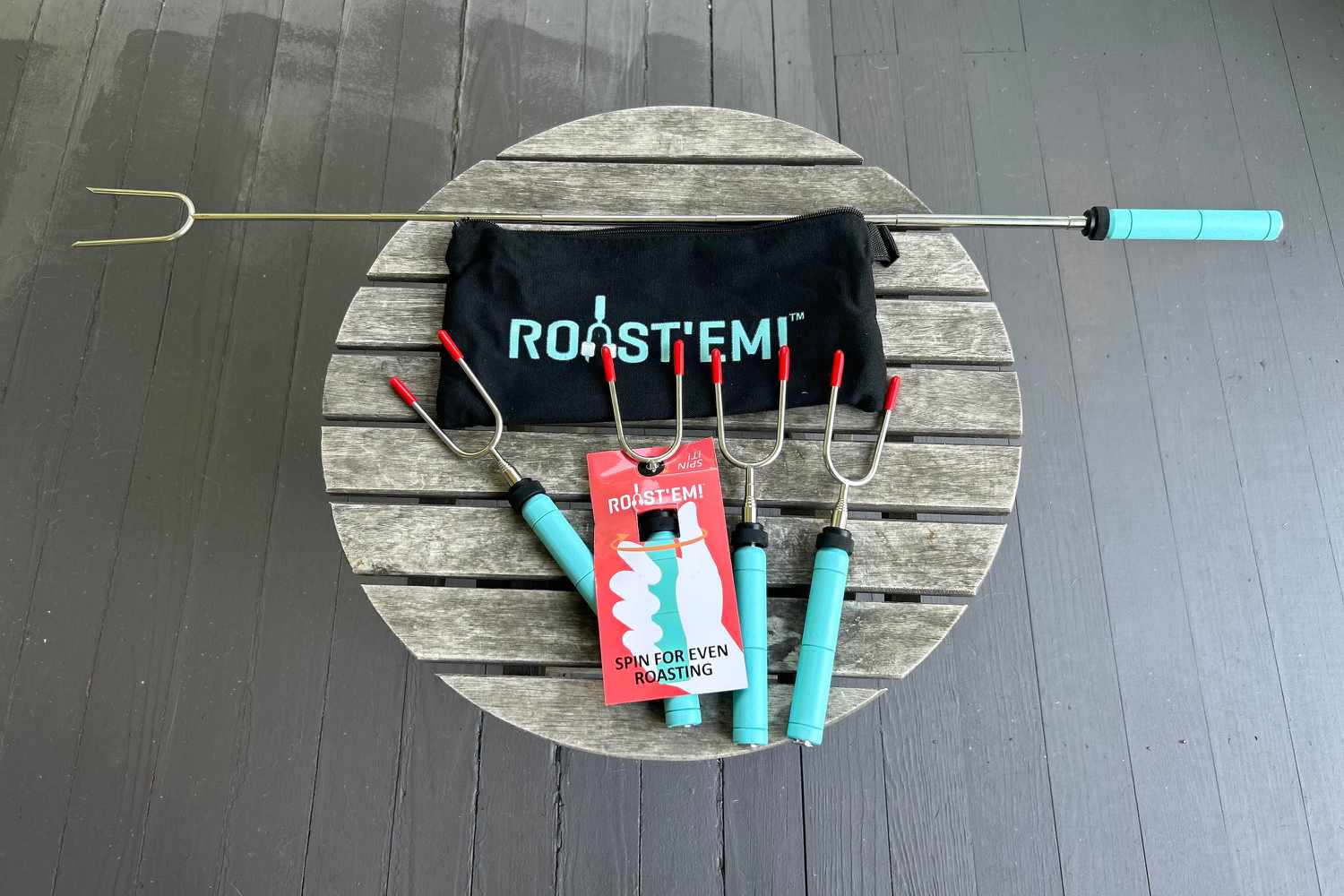 Jolly Green Roast‘Em Marshmallow Roasting Sticks displayed on an outdoor table