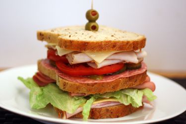 Dagwood sandwich on a plate. 