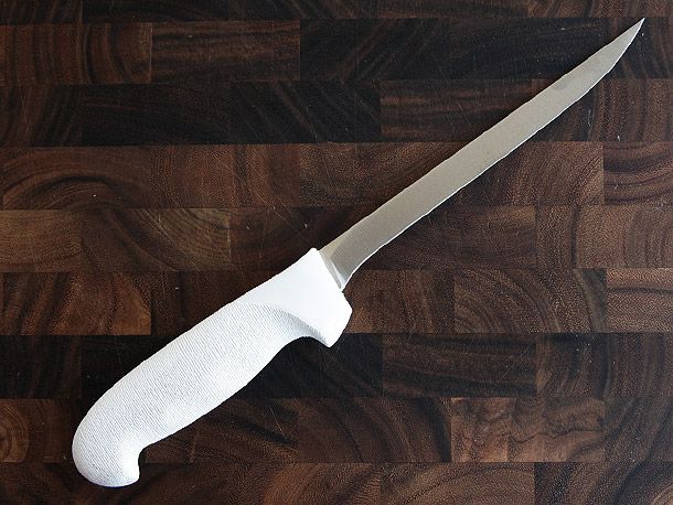 Dexter-Russel Narrow Fillet Knife on wooden cutting board
