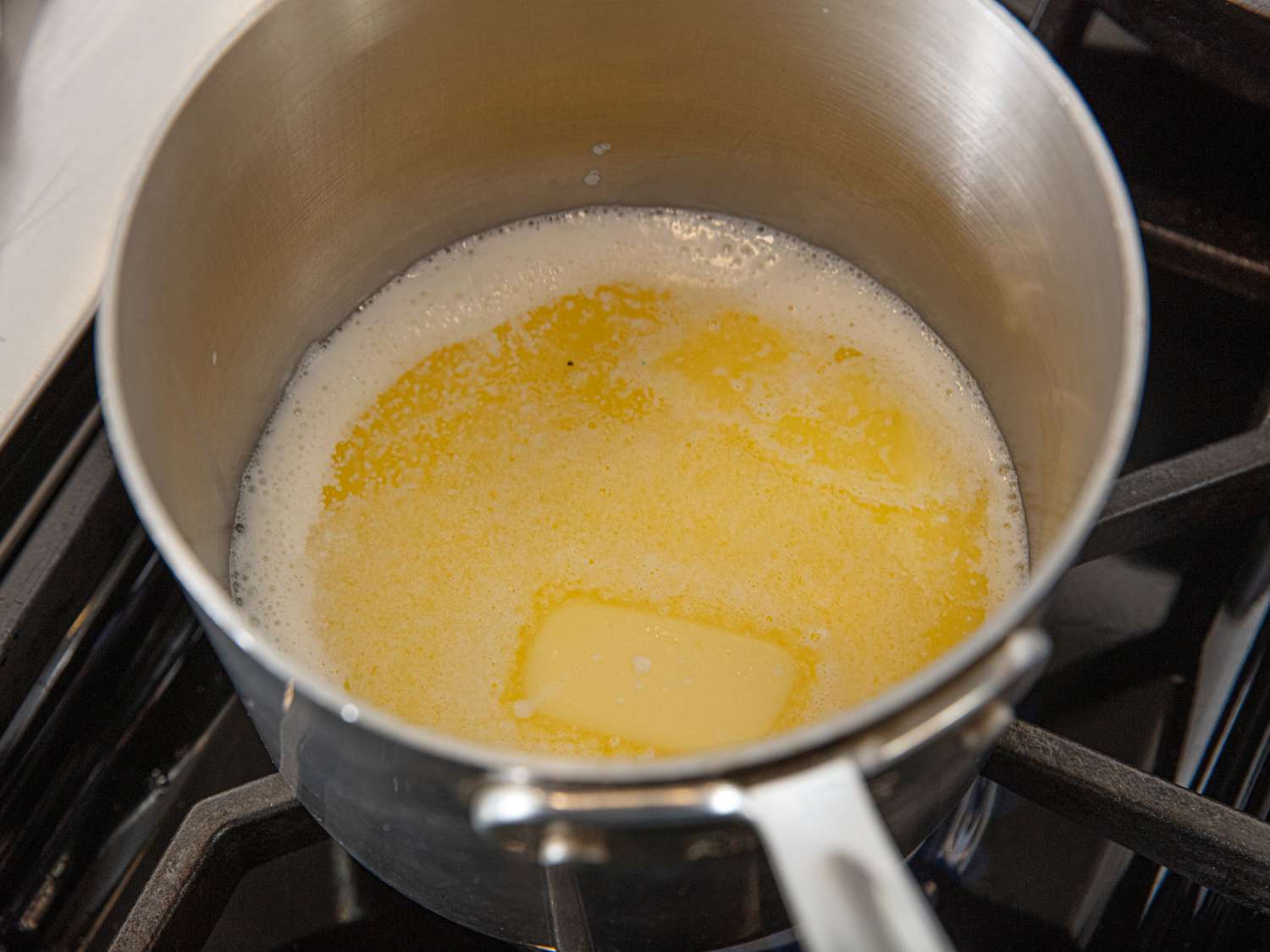 Melted butter in a saucepan on a stovetop