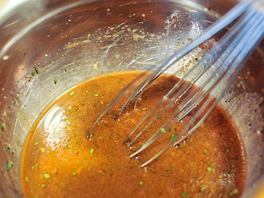 The marinade is whisked together in a bowl.
