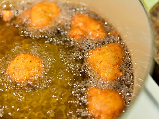 Deep-frying stuffing fritters.