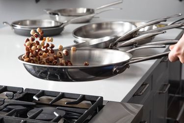 Hazelnuts jump in a skillet as part of a tossing easiness test in our review.