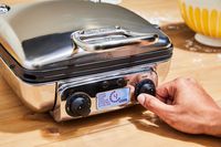 A waffle maker's digital display in use.