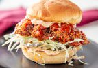 Side view of kimchi fried chicken Sandwich 