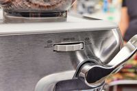 Close up of the coffee grinder size adjuster on the Breville Barista Express Impress
