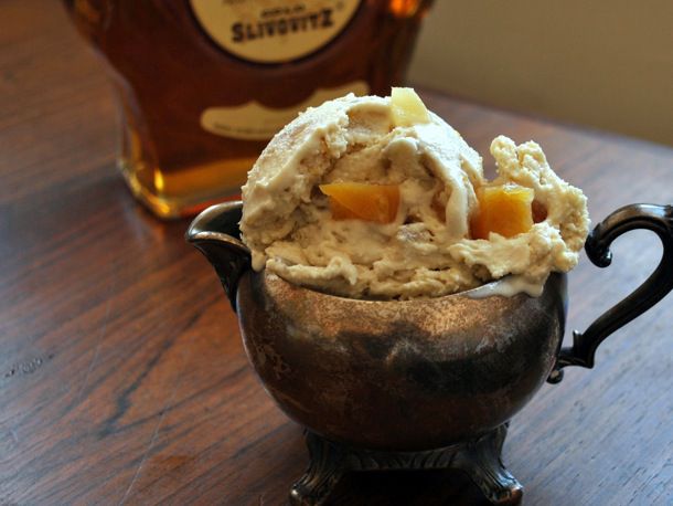 Lemon, Honey, and Brandy (or Guggle Muggle) Ice Cream, served in a pewter cream pitcher. A bottle of Slivovitz brandy is in the background.