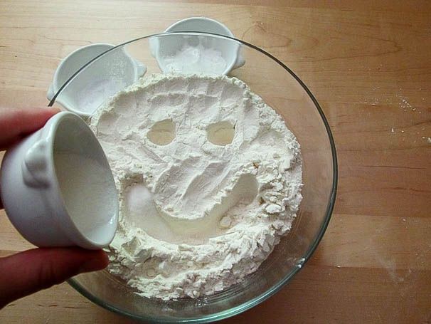 Dry ingredients for cream biscuits being mixed in a large glass bowl