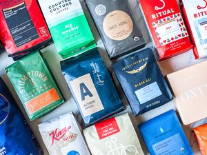 A variety of espresso coffee bags from different brands arranged side by side