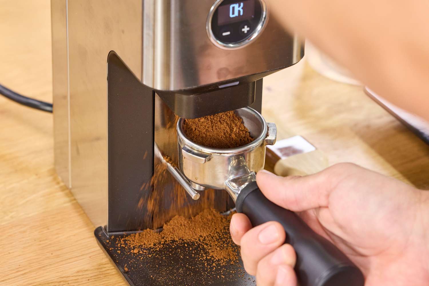 Ground coffee is made in the Lelit William Espresso Grinder