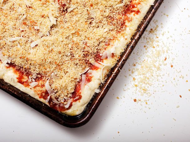 The assembled sfincione, ready to be baked.