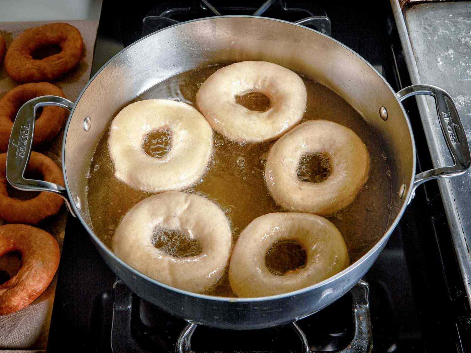 doughnuts frying in hot oil
