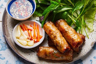 Side view of Imperial Rolls on a plate.